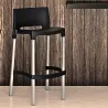 Tabouret professionnel bar en polypro noir en intérieur