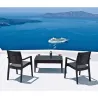 Fauteuil pour professionnel en polypro aspect résine tressée gris foncé sur une terrasse en surplomb de la mer